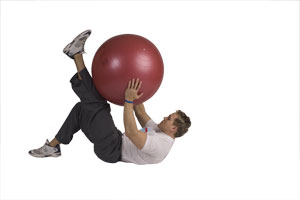 Lying Leg Extension Crunches with Exercise Ball